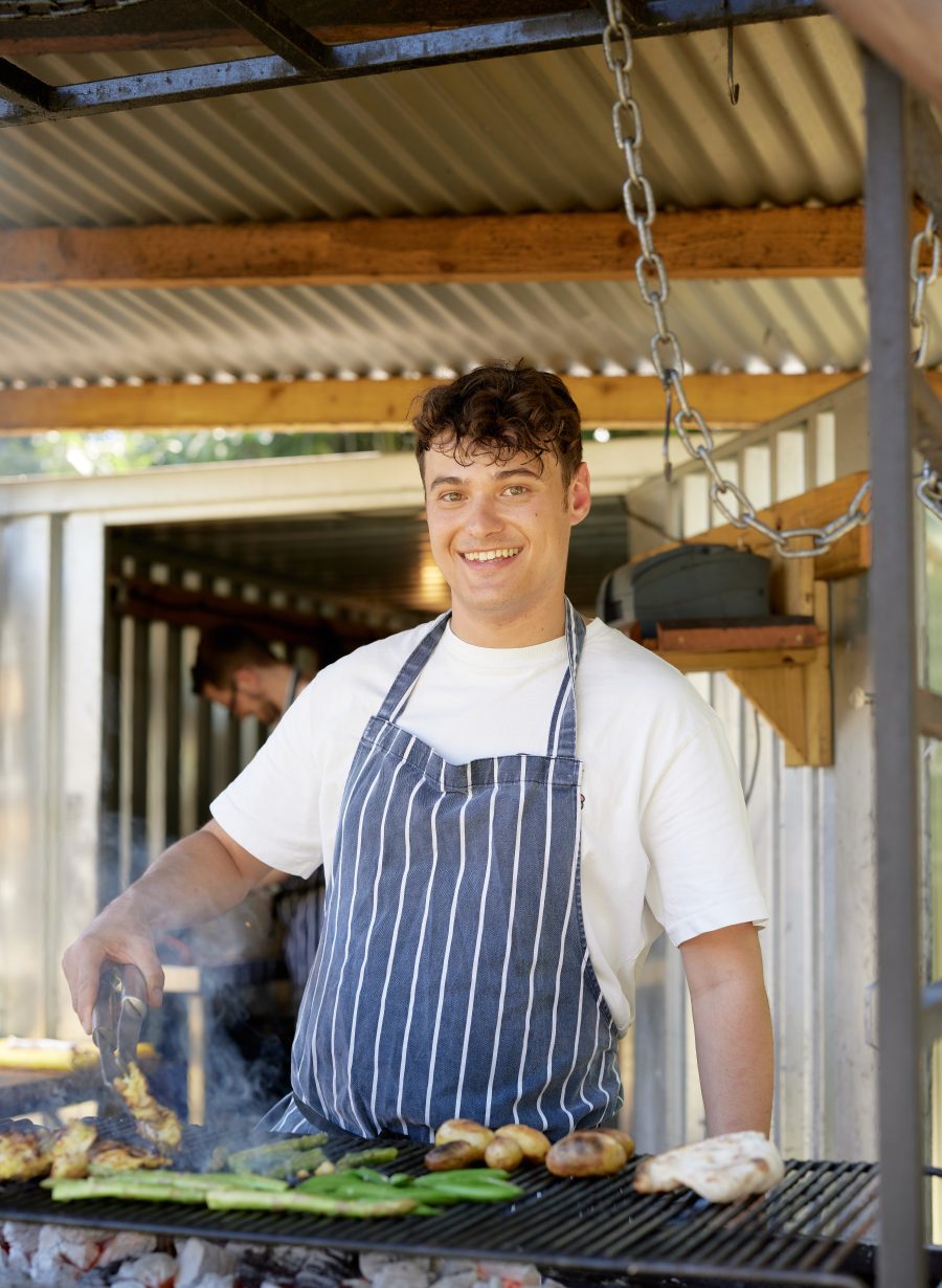 chef preparing food in front of the restaurant
