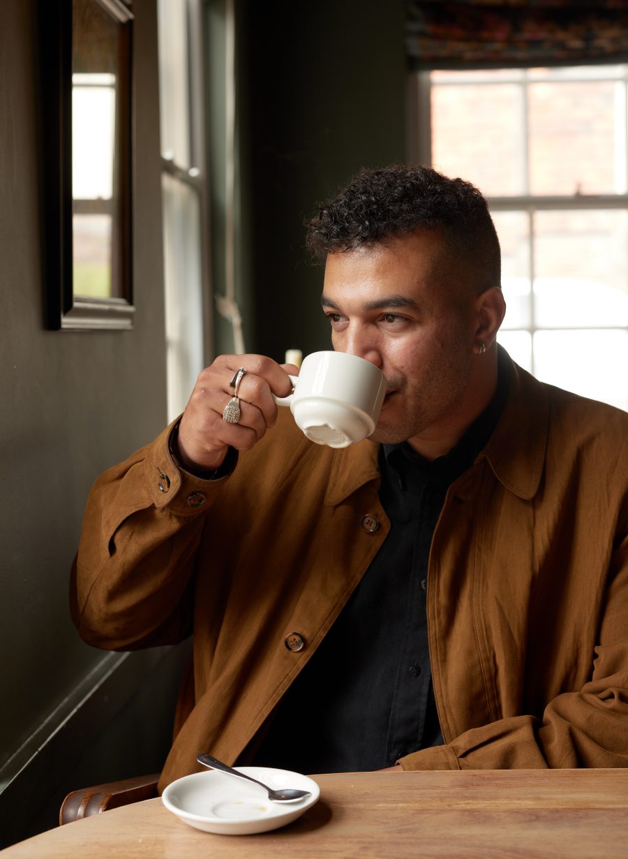 guest seated with coffee at restaurant