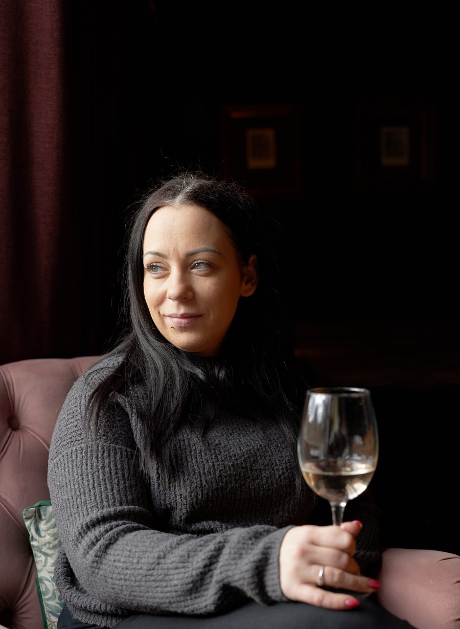 person with glass in hand, Pembroke